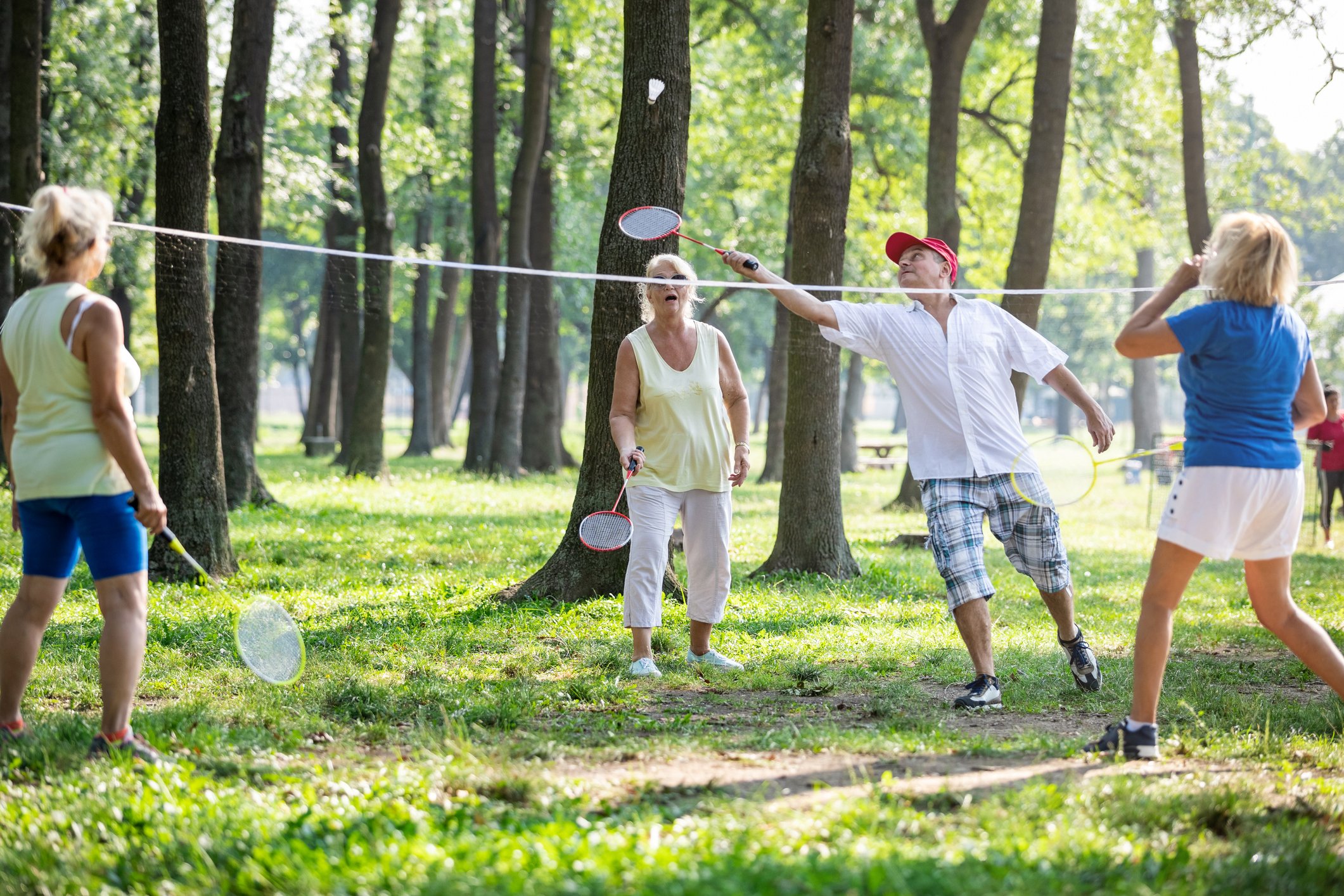 group of people playing badminton